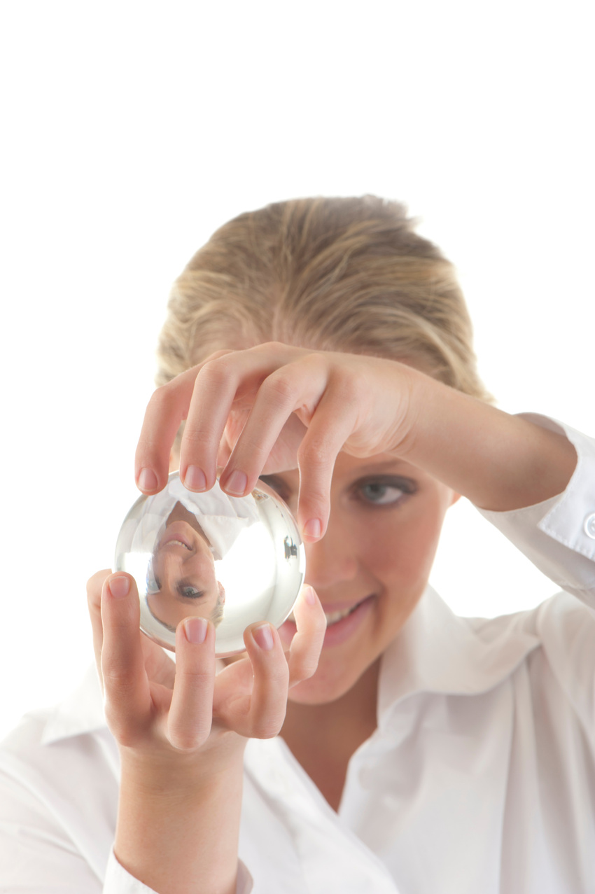 Woman looking through a crystal ball